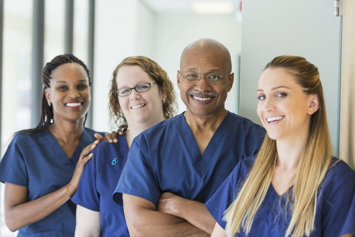 Doctor smiling while providing senior care services in Frisco, Texas